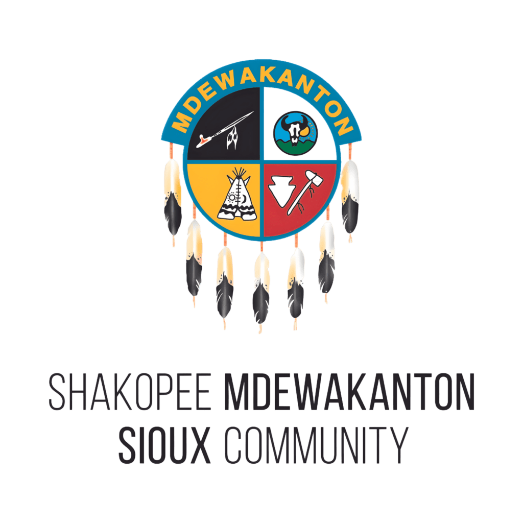 Logo of Shakopee Mdewakanton Sioux Community with symbolic elements and feathers.